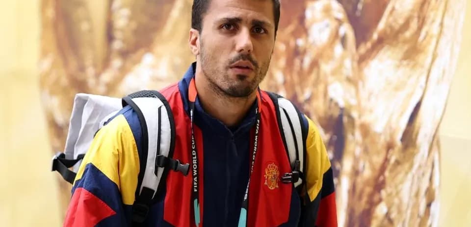 Sporting event participant in colorful jacket and backpack