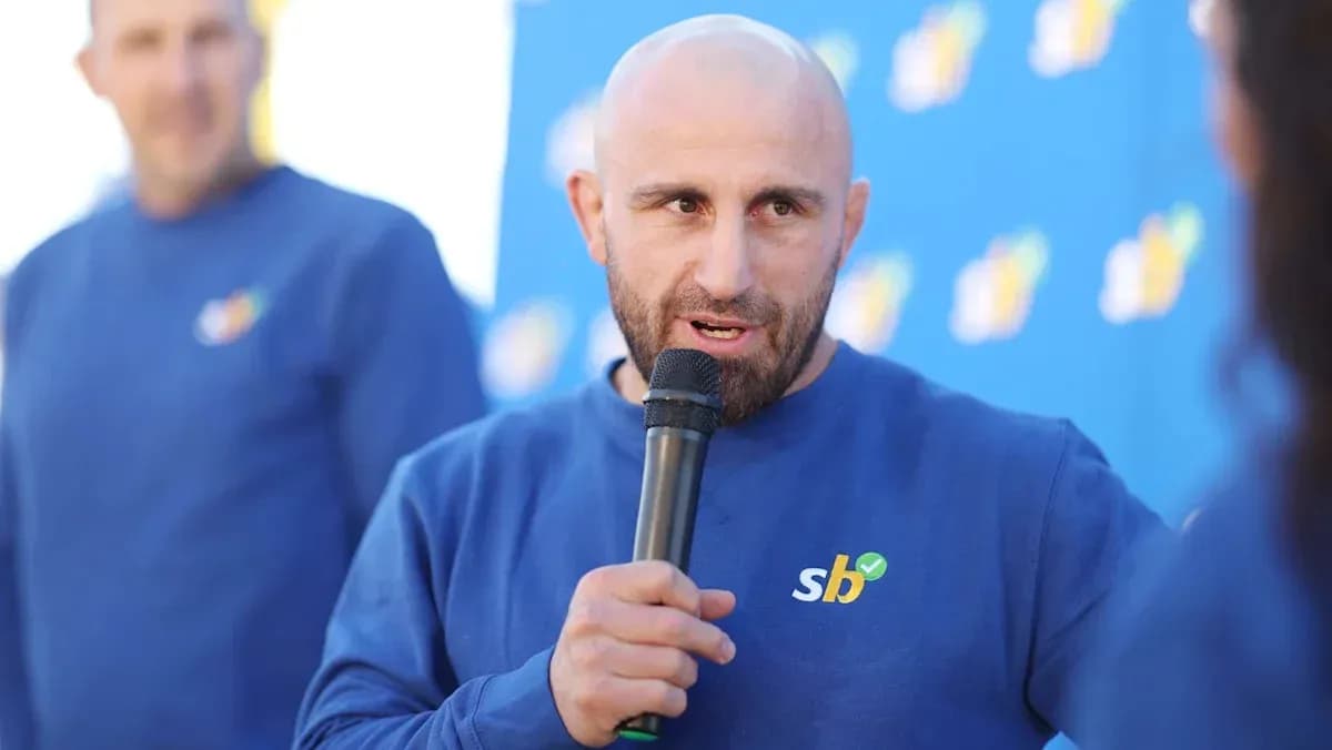 Man speaking into microphone at event