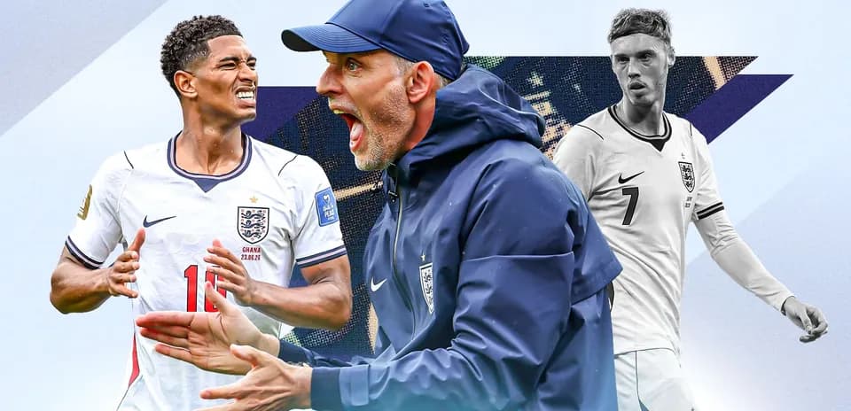Three football players in England kits during match