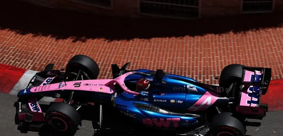 Formula 1 car racing around a corner on track
