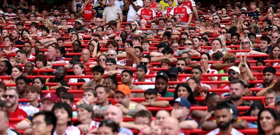 Arsenal fans in stands during a match
