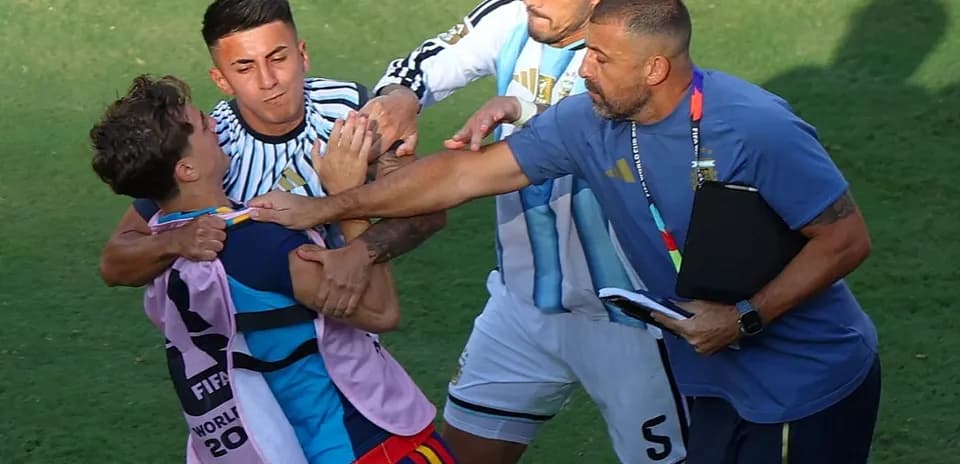 Players and staff involved in a scuffle on field