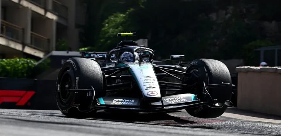 Formula 1 car racing around a corner on track