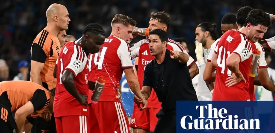 Arsenal players gathered around coach during match break