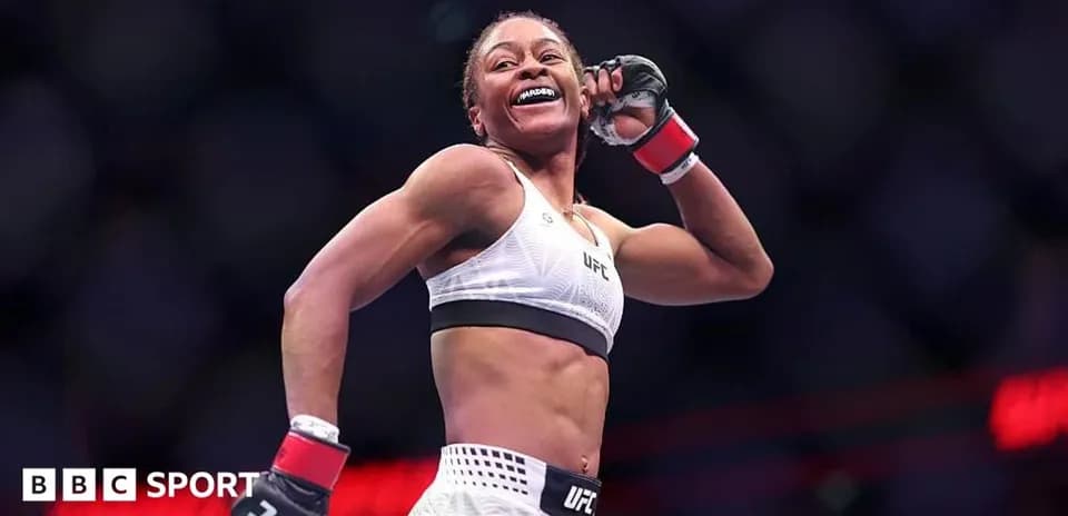 UFC fighter celebrating victory inside the octagon
