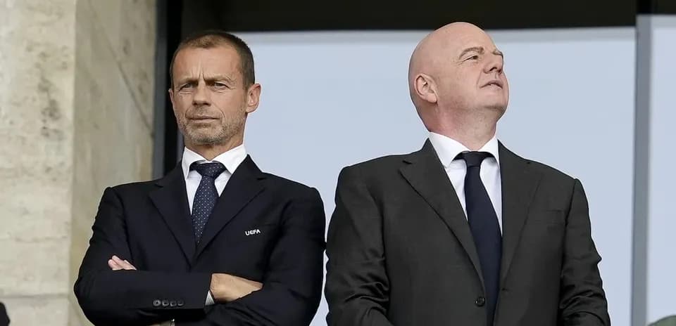 Two officials observing from the VIP stand