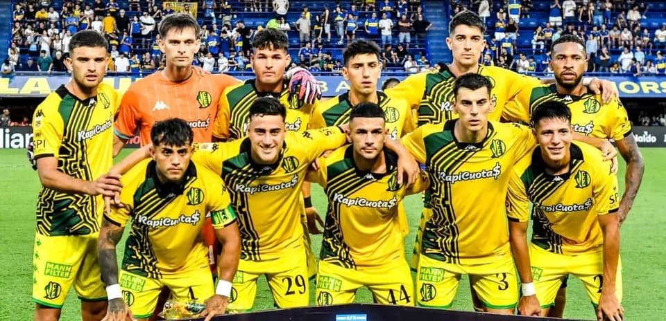 Football team posing for a group photo before match