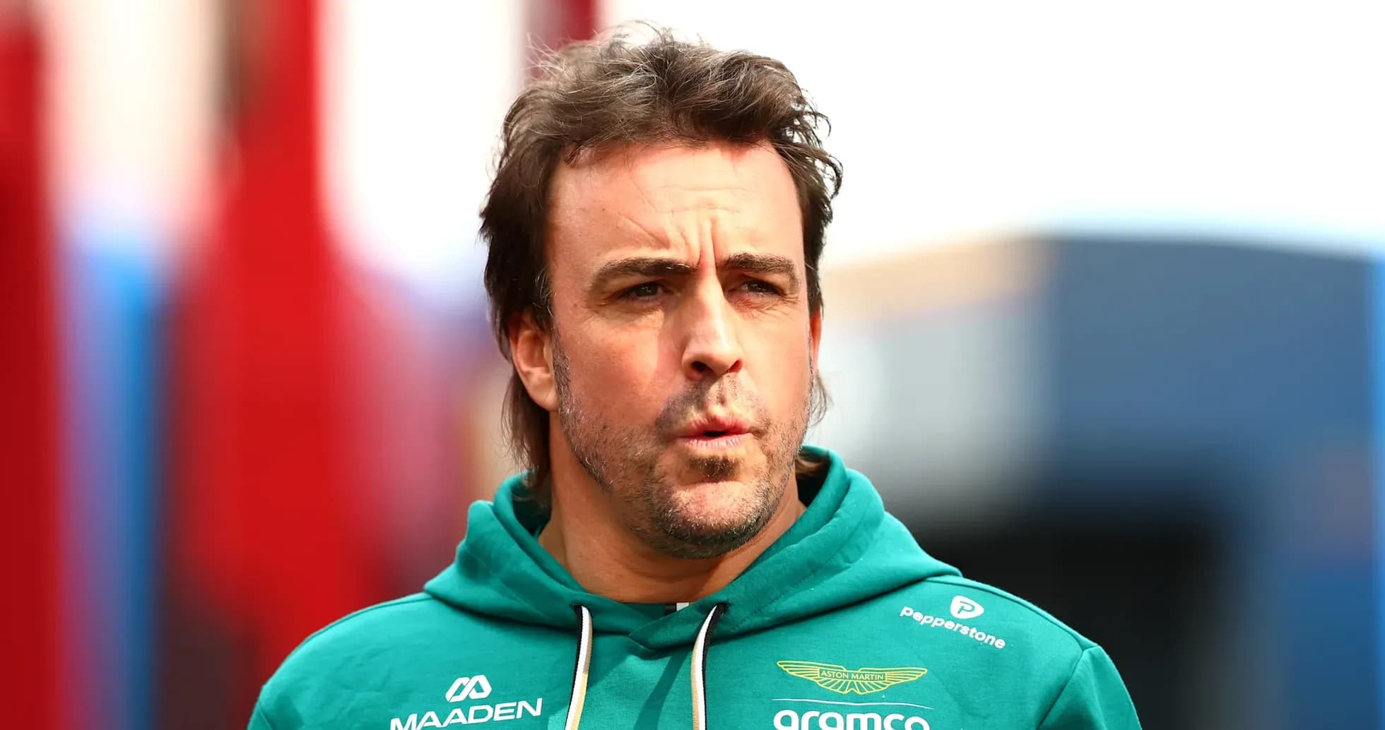 F1 driver in Aston Martin team hoodie