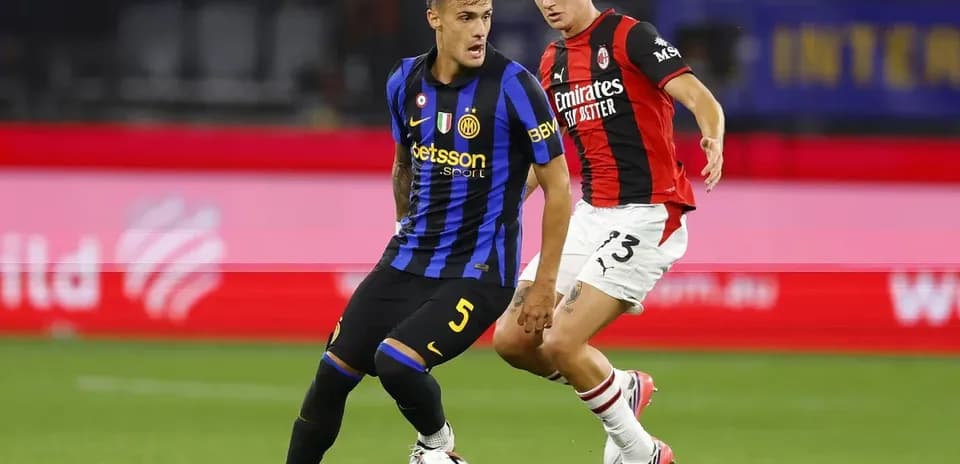 Inter and Milan players contesting the ball during match
