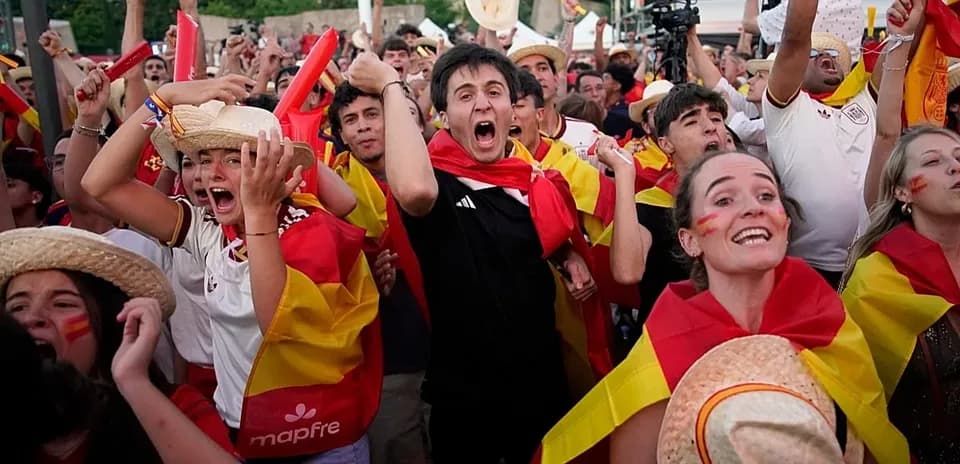Fans celebrating with flags at a sports event
