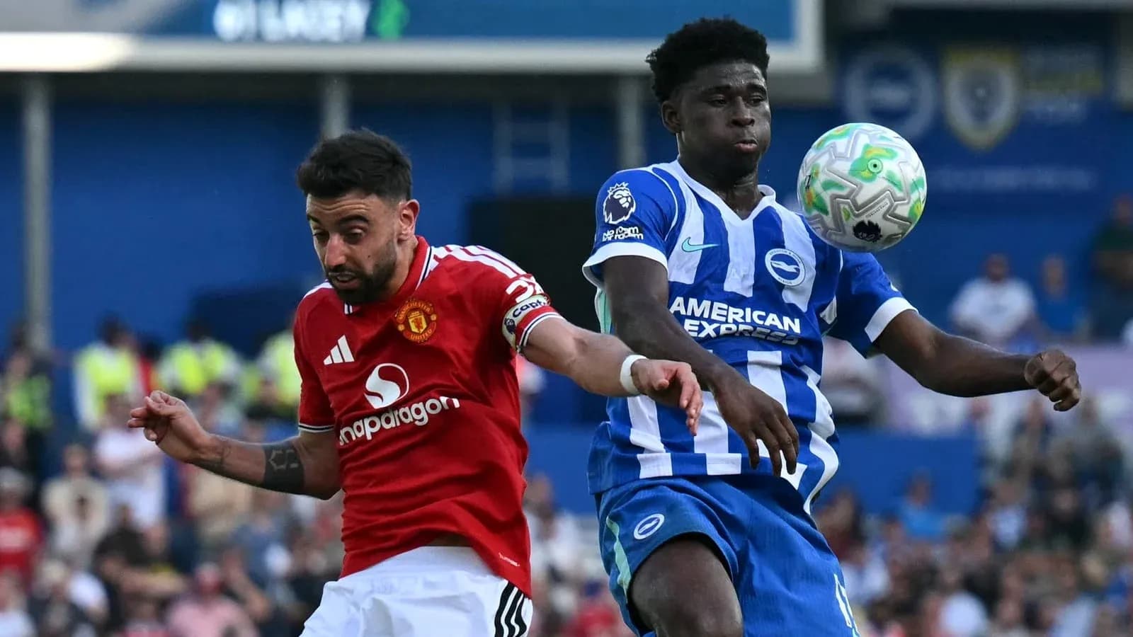 Bruno Fernandes and player contesting for the ball