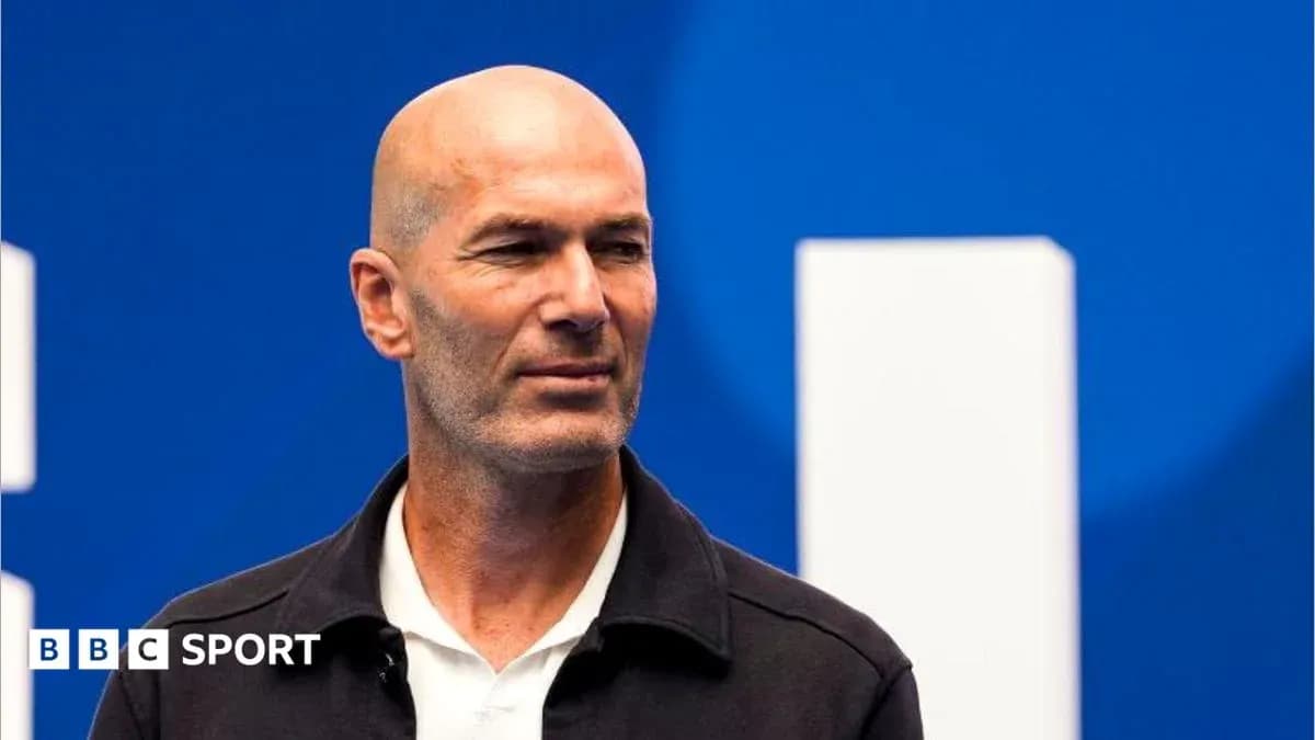 Zinedine Zidane at a press event with blue background Zinedine Zidane at a press event with blue background