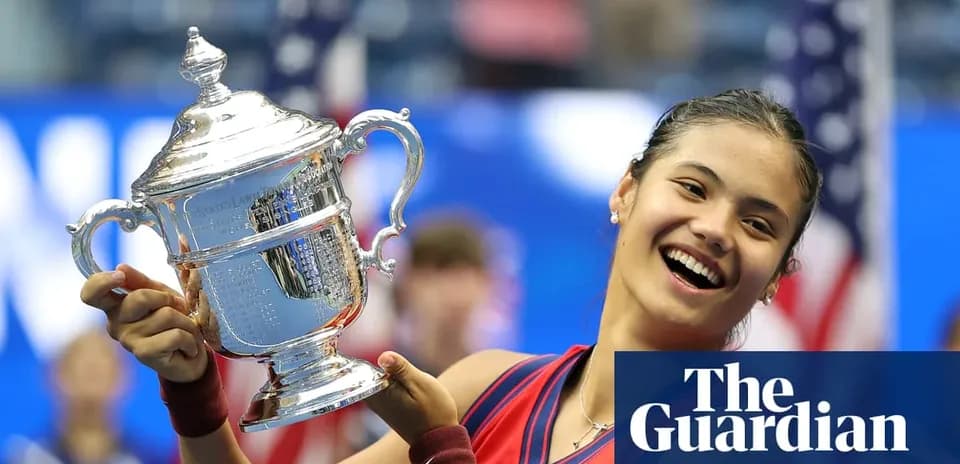 Tennis player holding US Open trophy proudly