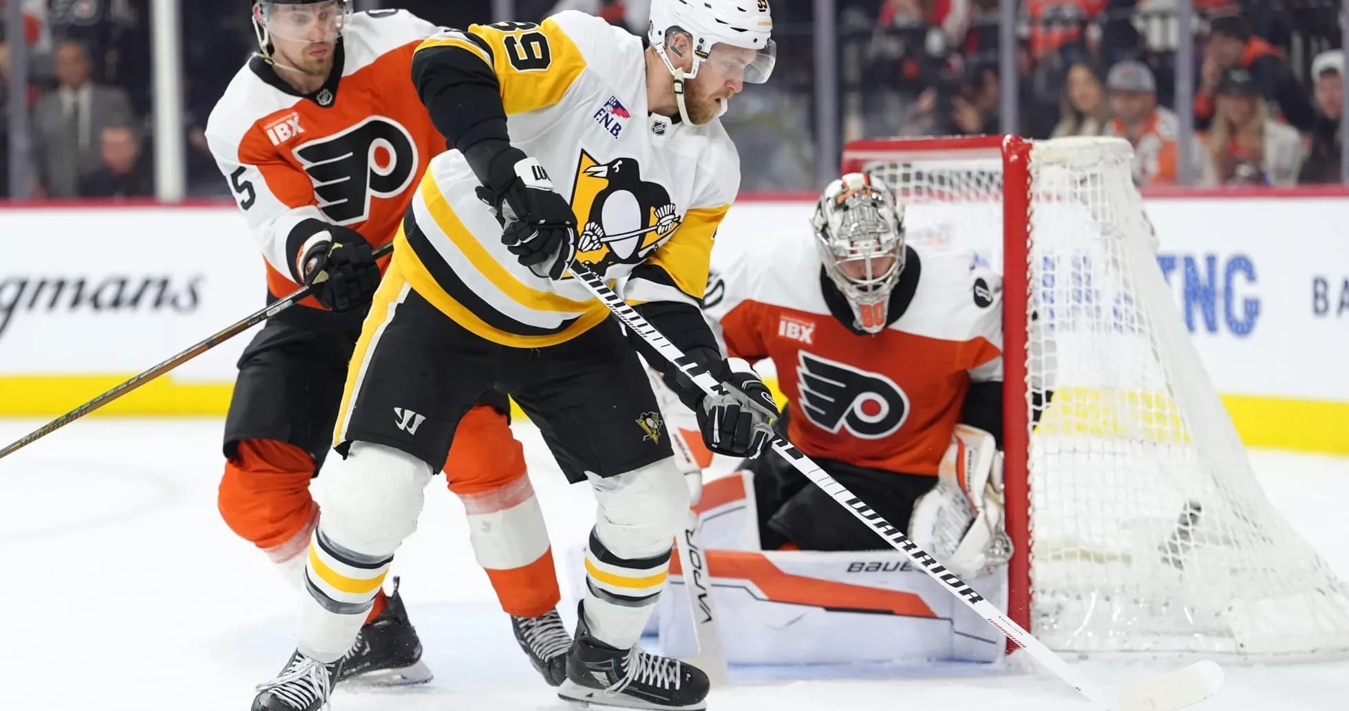 Ice hockey players competing for the puck