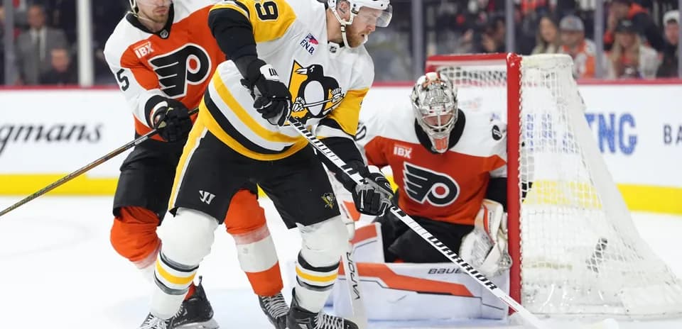 Ice hockey players competing for the puck