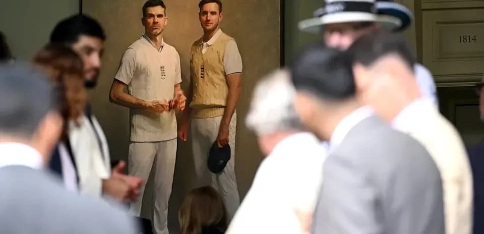 Portrait of two cricketers displayed at an event