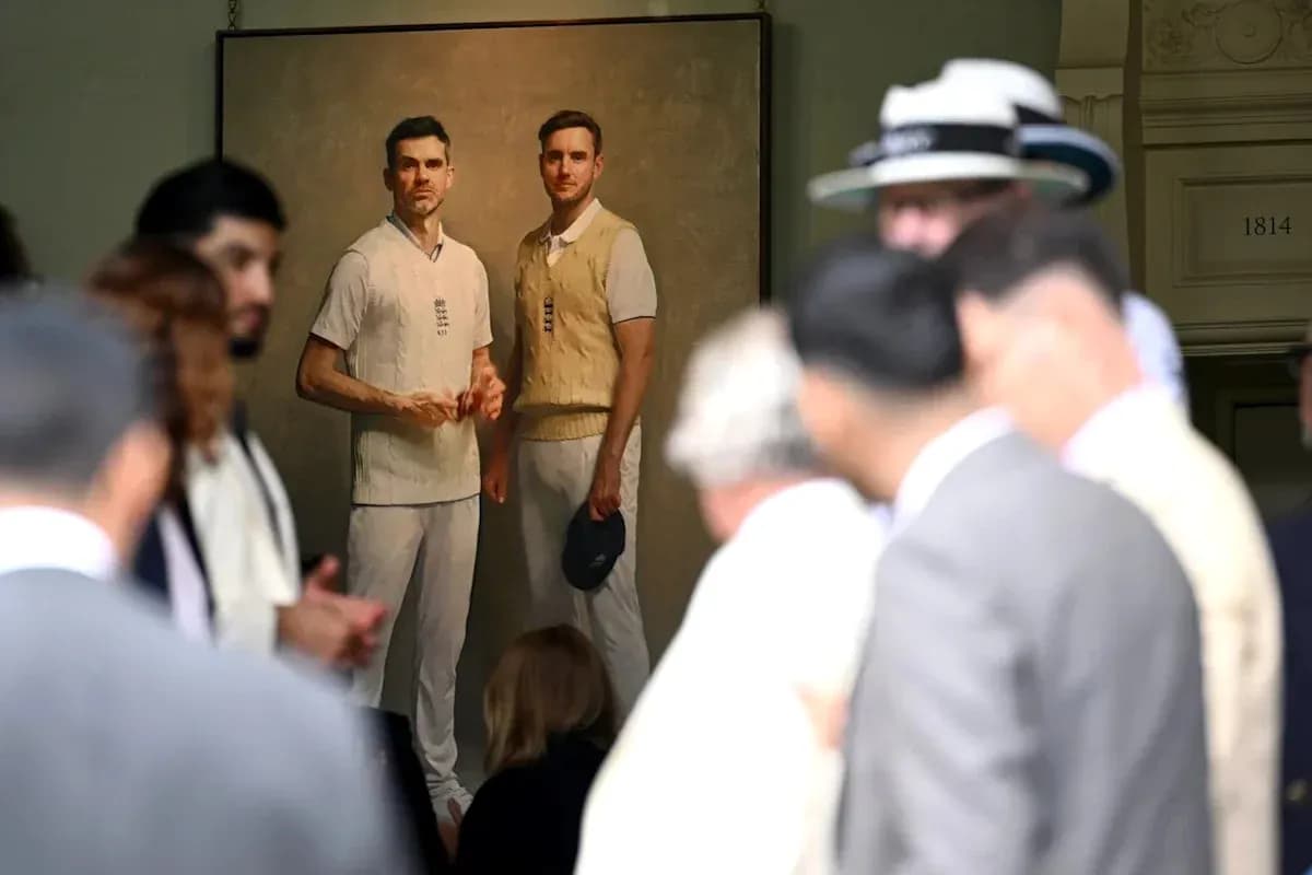 Portrait of two cricketers displayed at an event