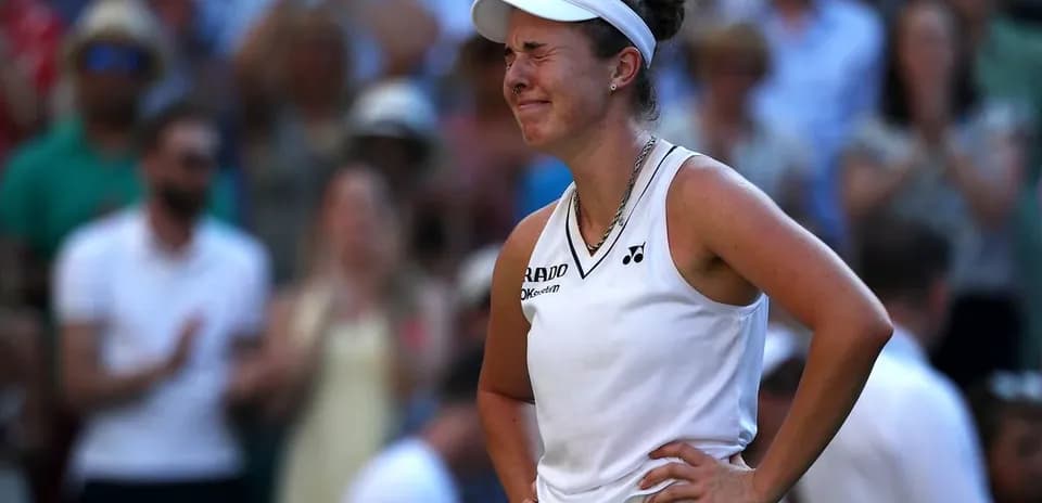 Tennis player reacting during match at Wimbledon