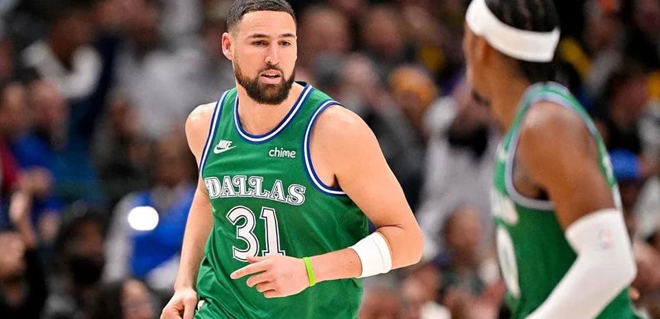 Basketball player in Dallas Mavericks jersey on court