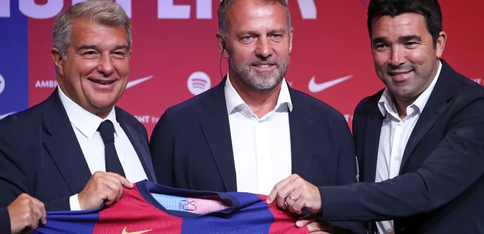 Officials presenting Barcelona jersey at press conference