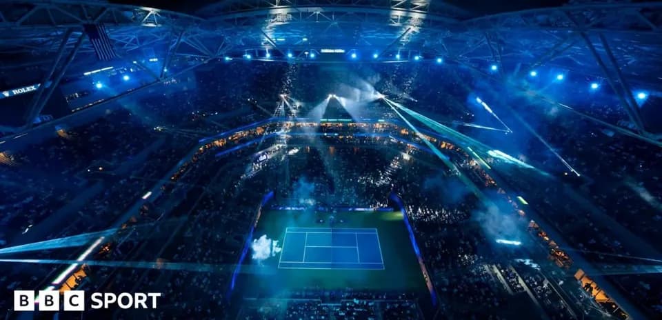 Aerial view of tennis match with dramatic lighting
