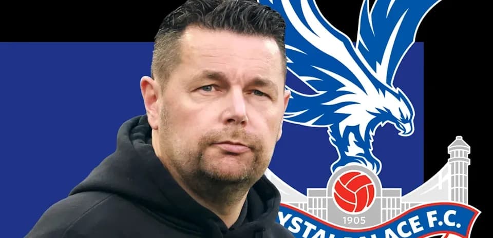Men's football coach with Crystal Palace logo background