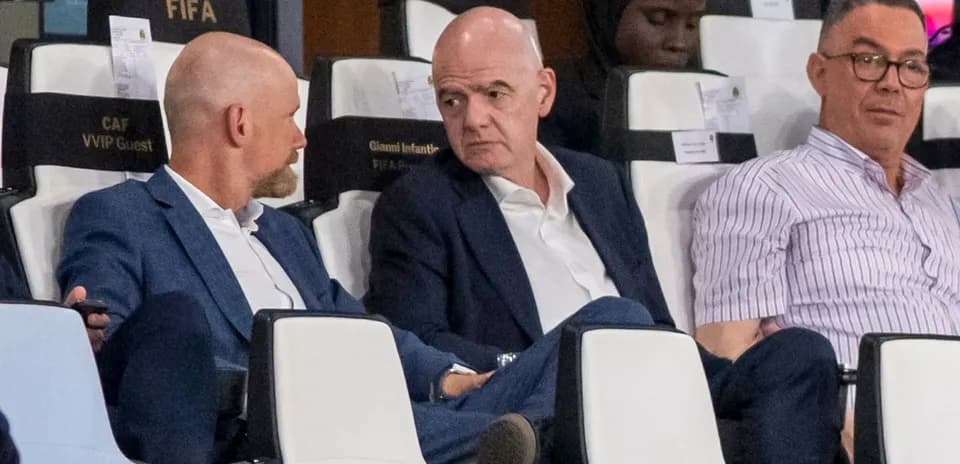 Three officials seated in VIP section during event