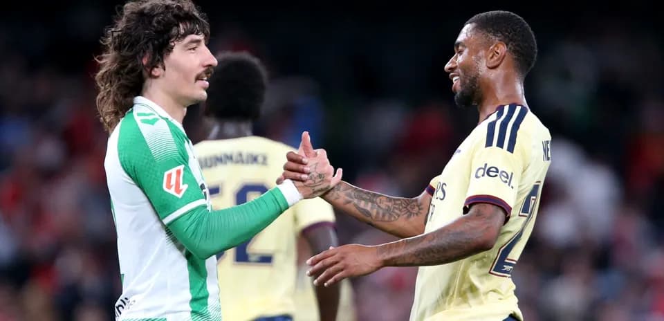 Two players shaking hands after a match