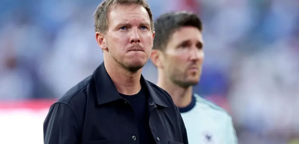 Coaches observing the match from the sidelines