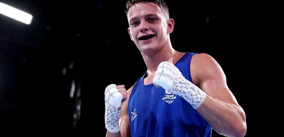 Boxer celebrating victory in blue outfit