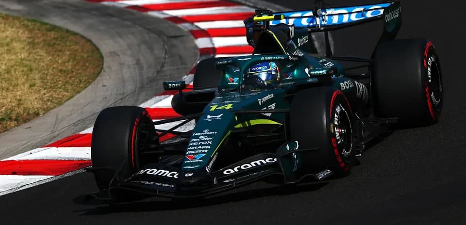 Formula 1 car navigating a sharp corner on track
