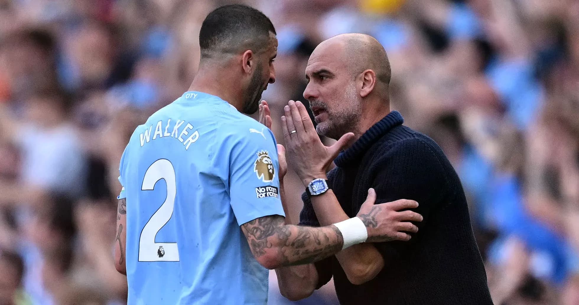 Walker discussing strategy with Guardiola on pitch