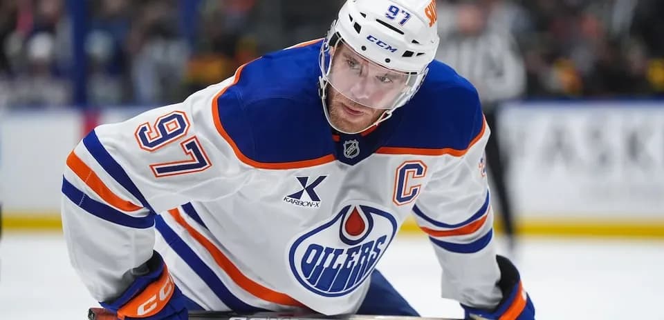 Hockey player wearing Oilers jersey on the ice
