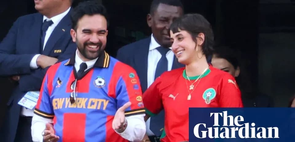 Two fans wearing soccer jerseys at event