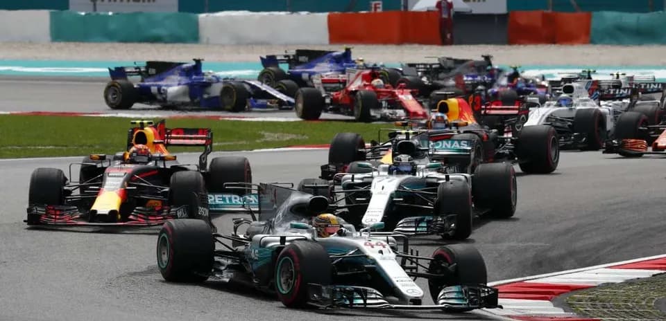 Formula 1 cars racing on track during competition