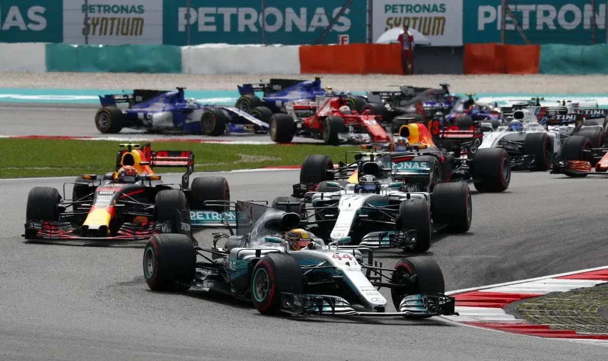 Formula 1 cars racing on track during competition