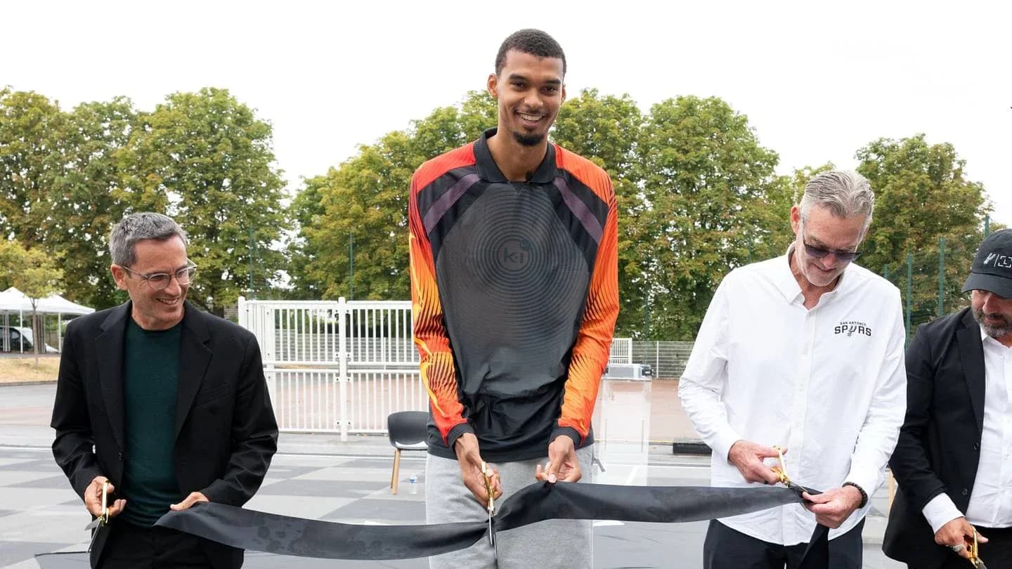 Ceremony for opening a basketball court with officials