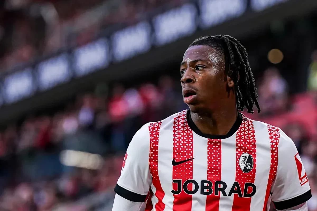 Freiburg player in red and white jersey during match