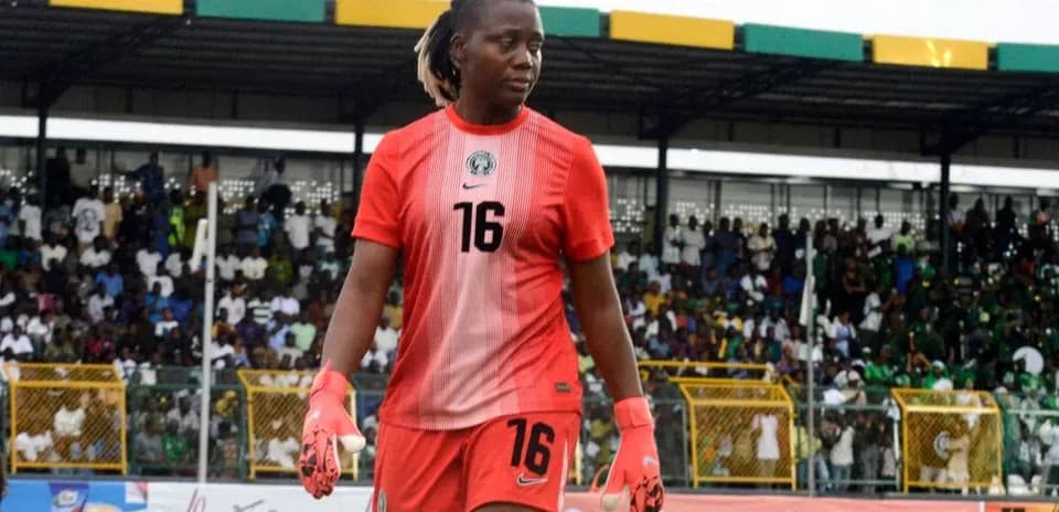 Goalkeeper walking on the pitch during match