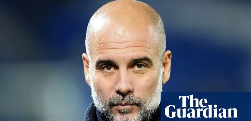 Bald man with a beard in a dark jacket