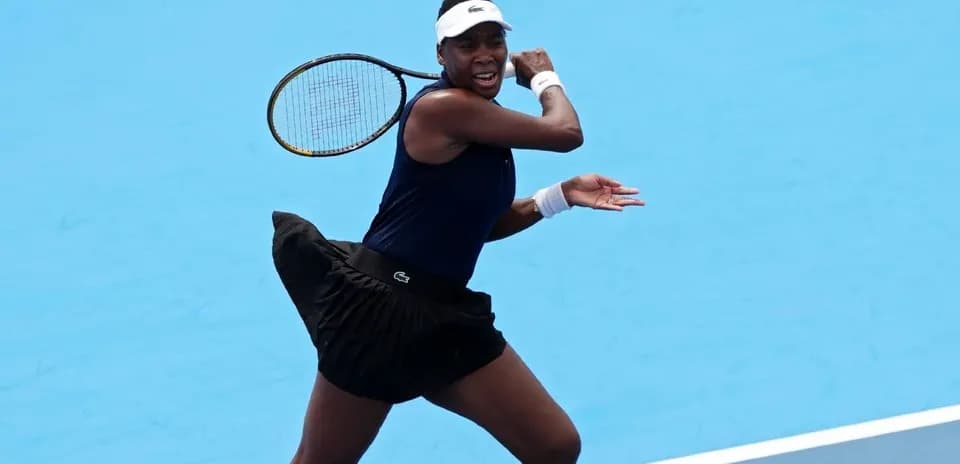 Tennis player hitting a backhand shot on court