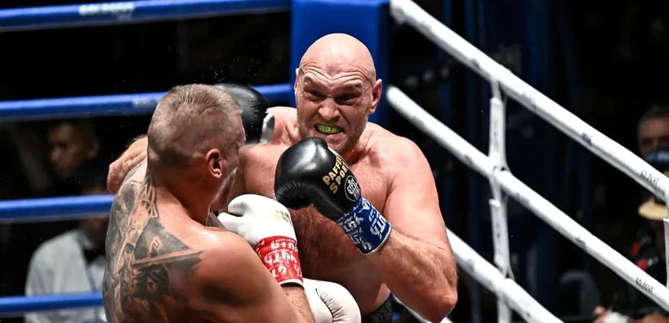 Boxer delivering a punch in the ring