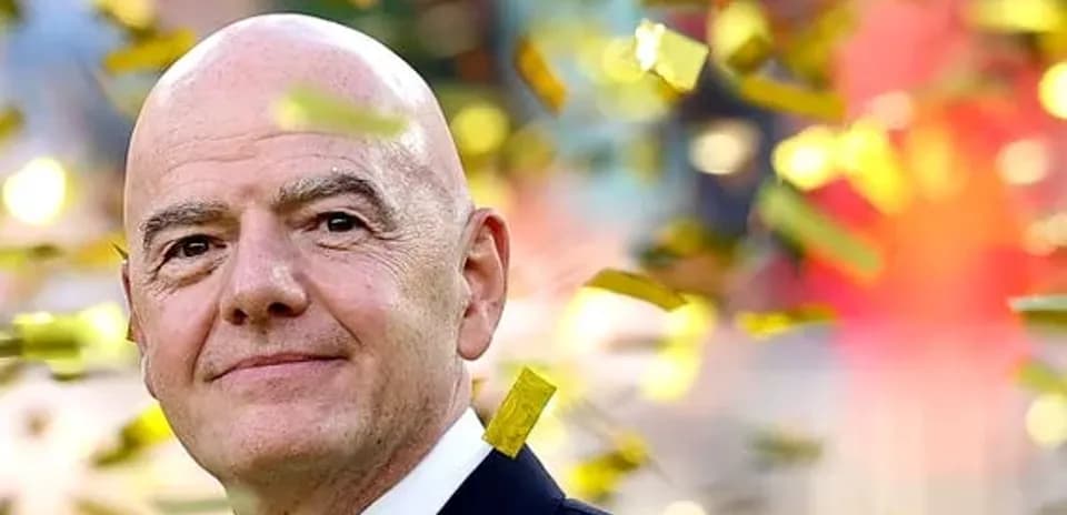 FIFA official surrounded by confetti at event