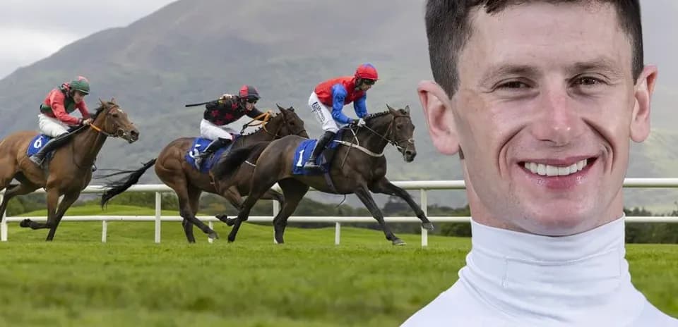 Jockey riding during horse race on grass track
