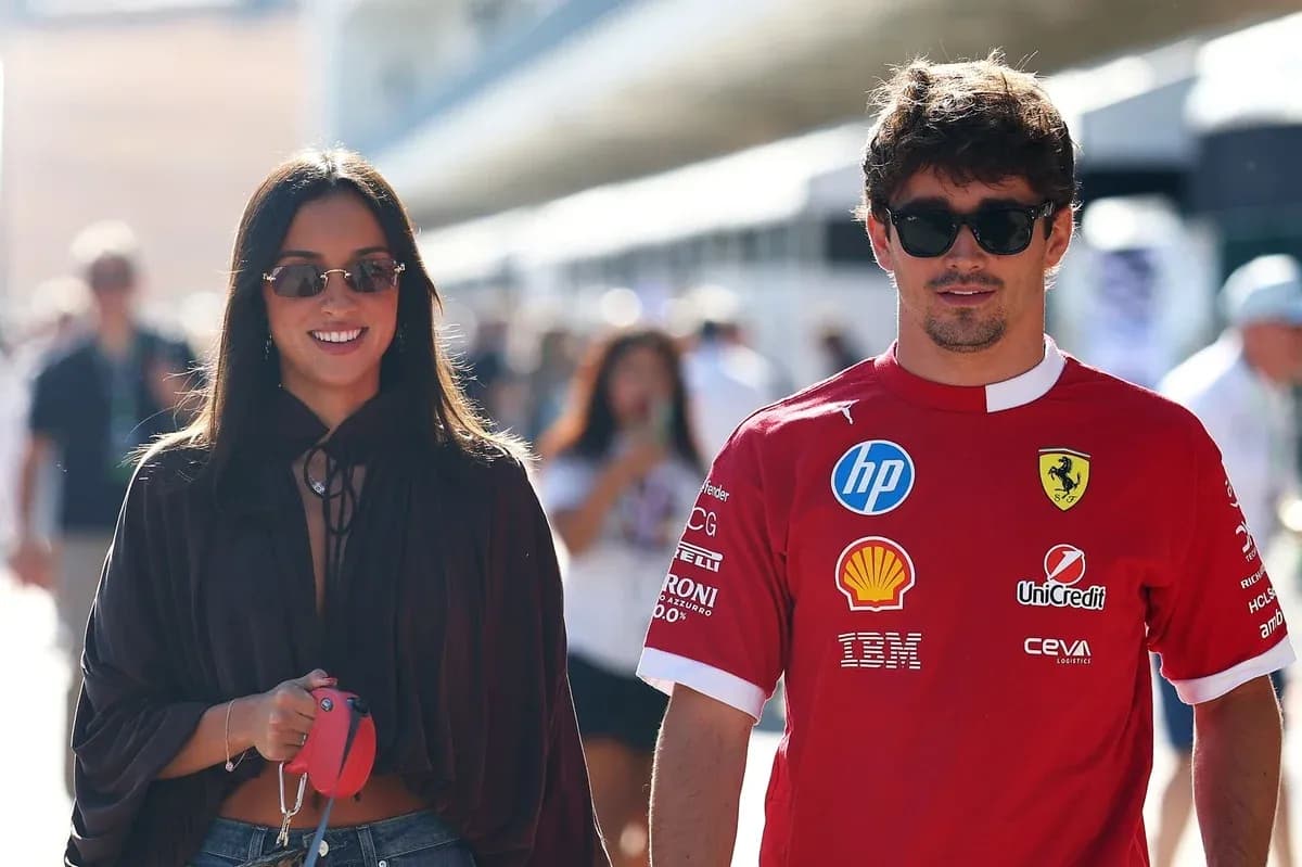 Couple walking together at a racing event Couple walking together at a racing event