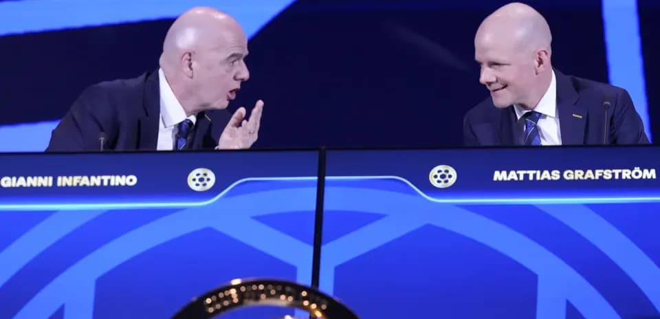 Gianni Infantino and Mattias Grafström at podium