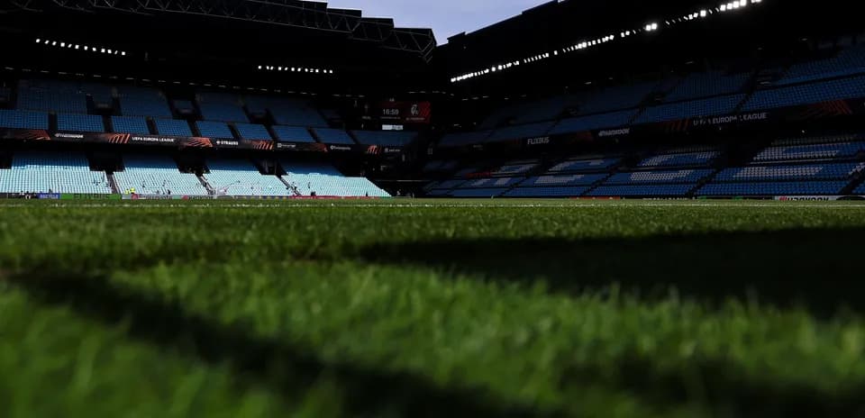 Stadium view with empty seats and grass field