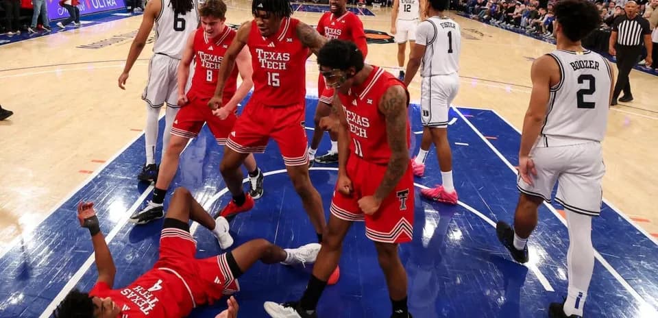 Texas Tech players celebrating after a successful play