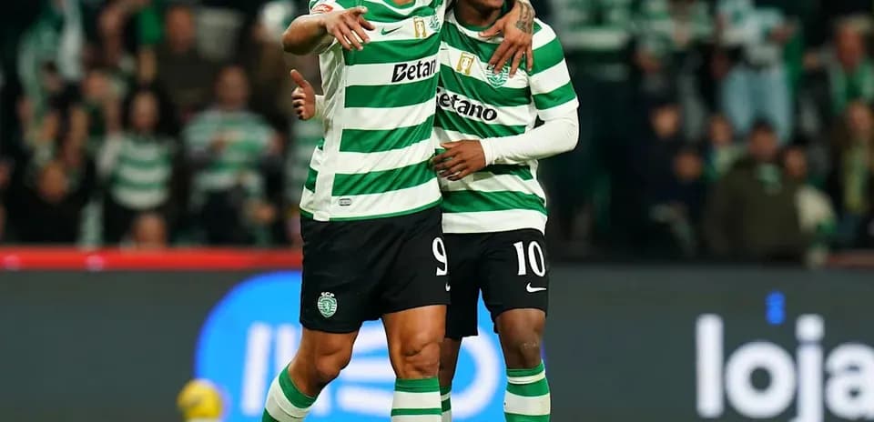 Sporting players celebrating a goal on field