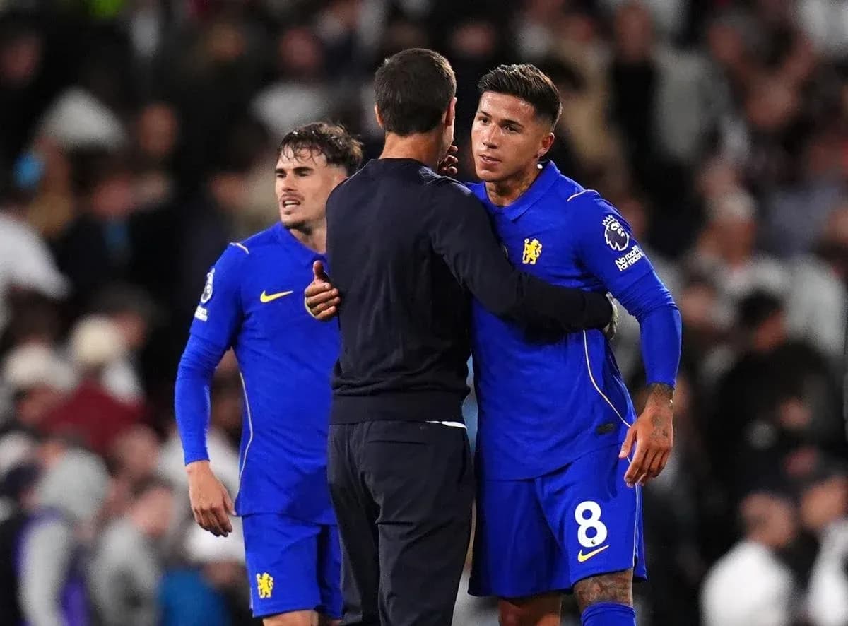 Chelsea players interacting with coach after match